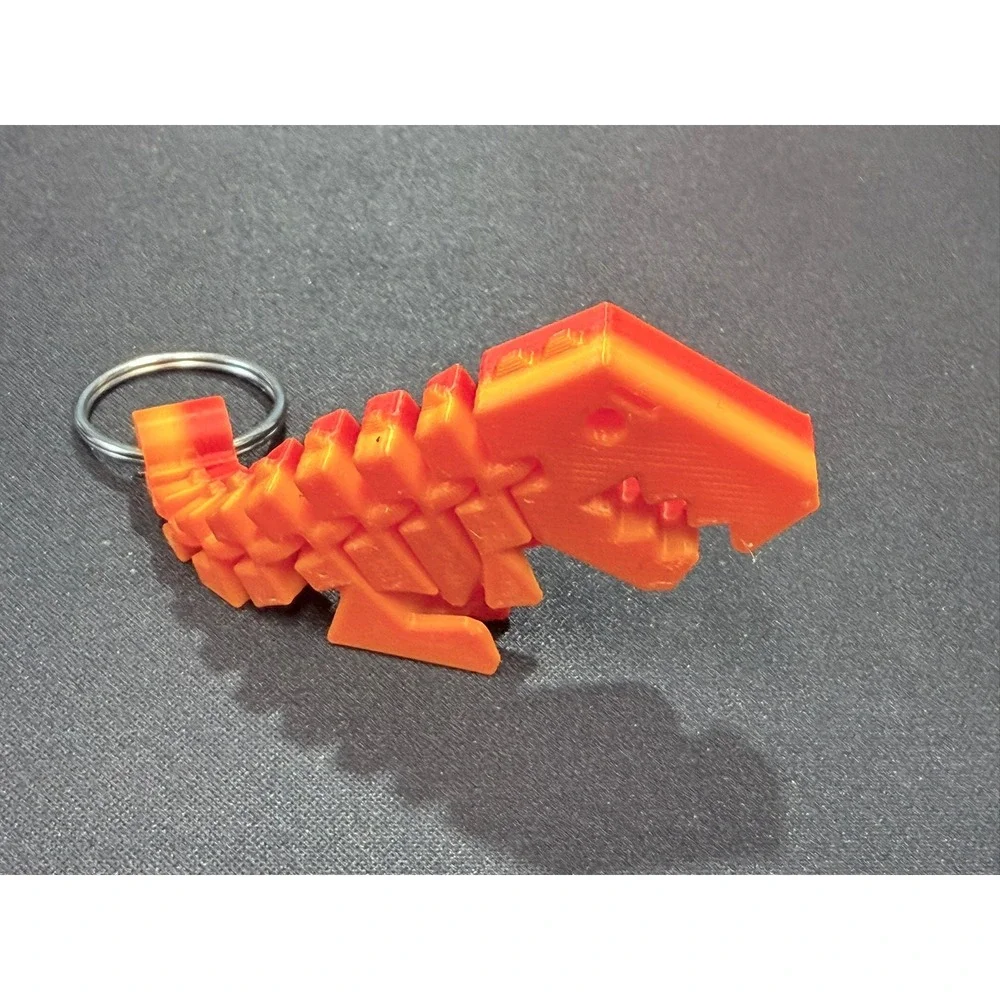 3D Printed Articulated T-Rex Keychain Orange Red Gradient Flexible Dinosaur Toy
